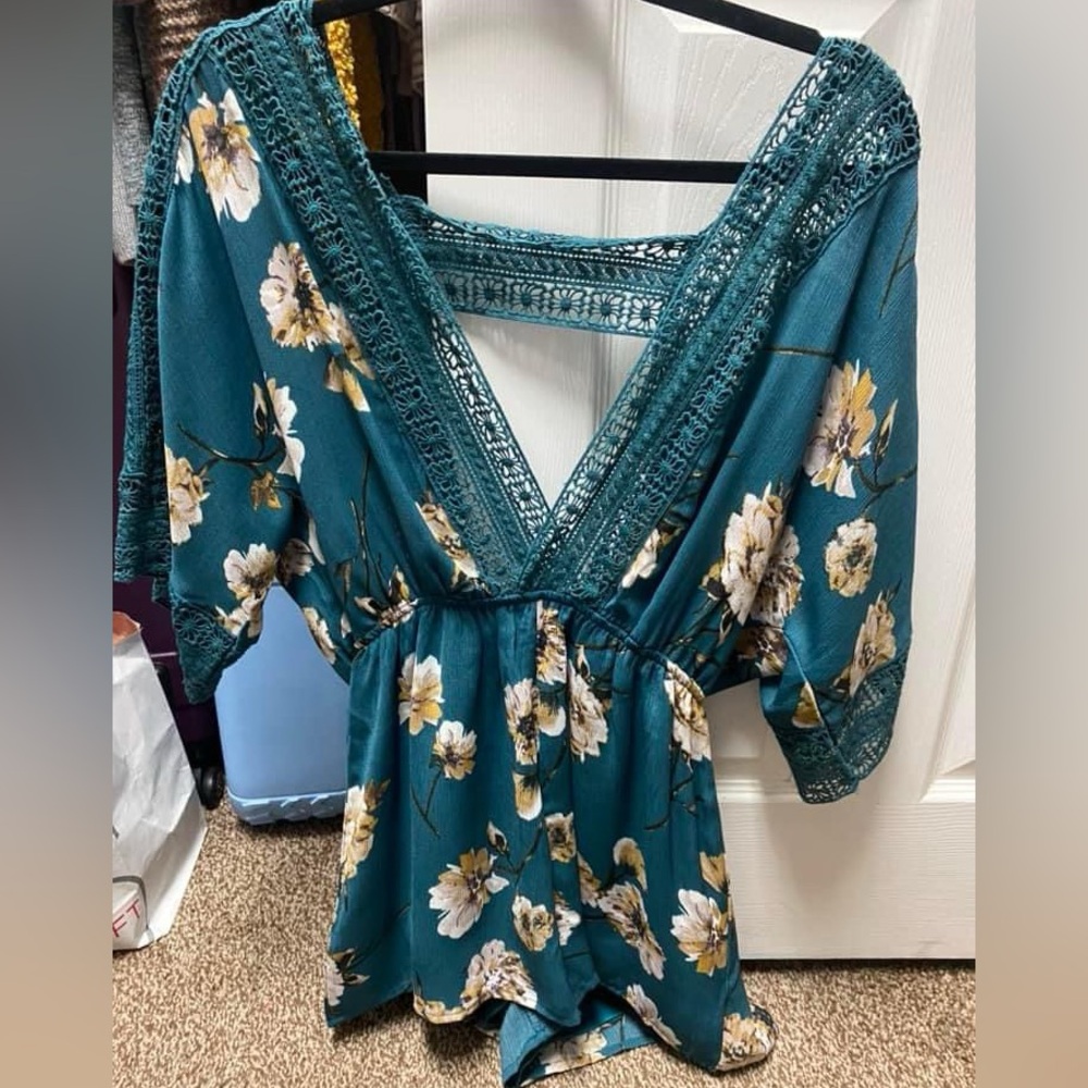 Boutique brand romper. Never worn. Size medium